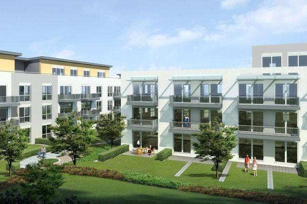 Apartment complex architectural render — residential development with landscaped courtyard