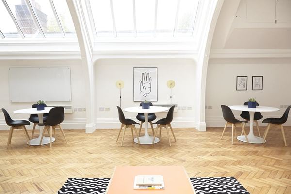 Commercial office interior render — open plan workspace with skylights and parquet flooring